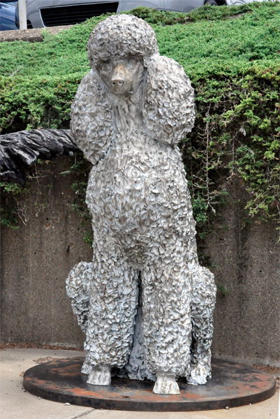 white poodle dog statue